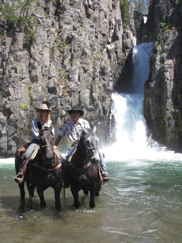 Ryan & Lisa on horse near waterfall - Rocky Mountain horse breeders